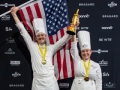 Stefani-Bradley-holding-up-flag-statue-TeamUSA_NOLA-570-photocredit_KenGoodman